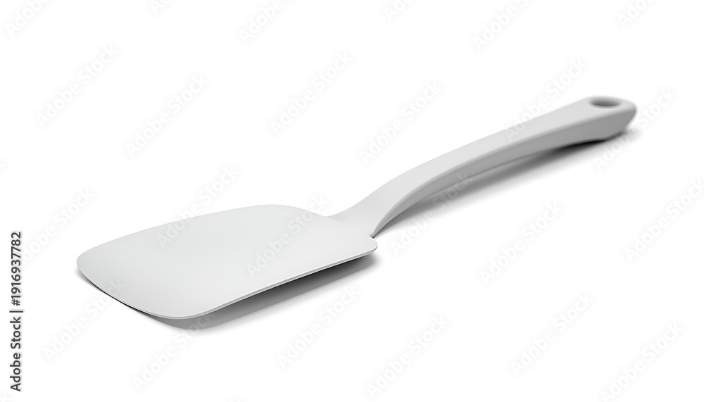 Fototapeta premium A white plastic spatula with a hole in the handle on a plain white background