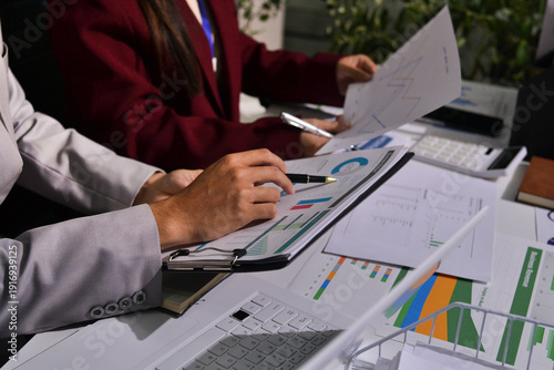 Schilderij op canvas Business people analyzing monthly budget and financial report using data and chart to strategize and plan for their future business while working together in the office