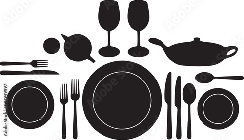 Black and white dining table setting with plates and cutlery