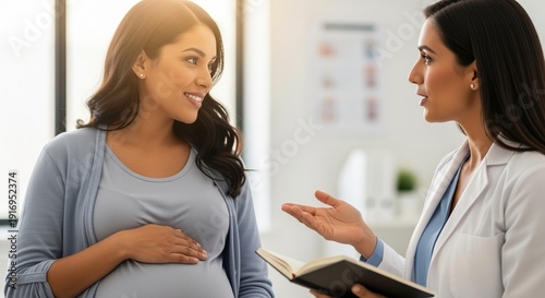 pregnant woman consulting with female doctor in hospital office discussing healthcare options
