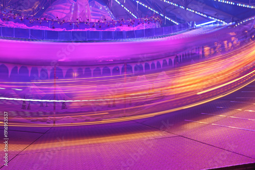 Pink and Purple Trail Lights Amusement Park Fun Fast Ride Long Exposure