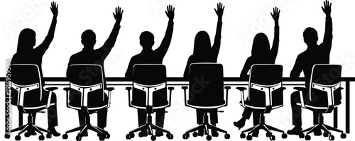 Silhouette of group of people sitting at conference table raising hands to vote or volunteer during business meeting.