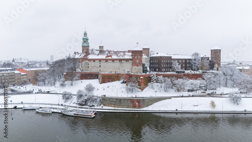 Aerial view of Wawel Castle in Krakow in winter, covered in snow.