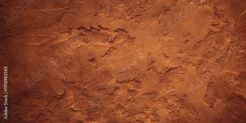 Fotografija Close up view of a textured reddish brown surface resembling dried mud or aged e