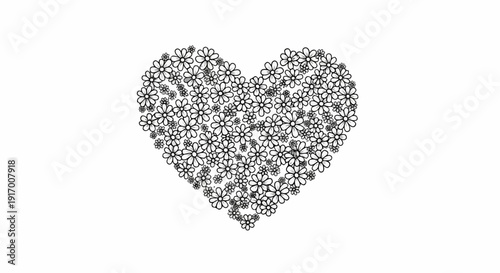 A heart shape is filled with many small black and white daisy-like flowers