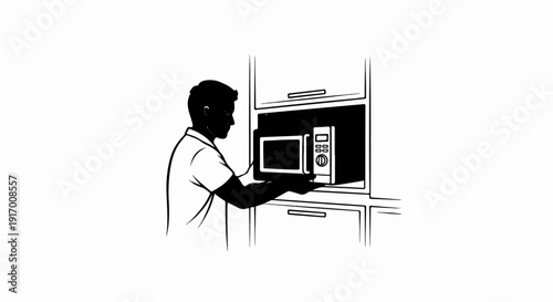 A person places a microwave in a cabinet opening