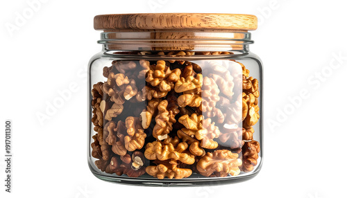 Glass jar filled with shelled walnuts, topped with a wood lid against a black background