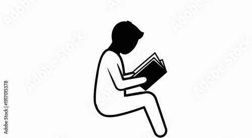 Silhouette of a person sitting and reading an open book