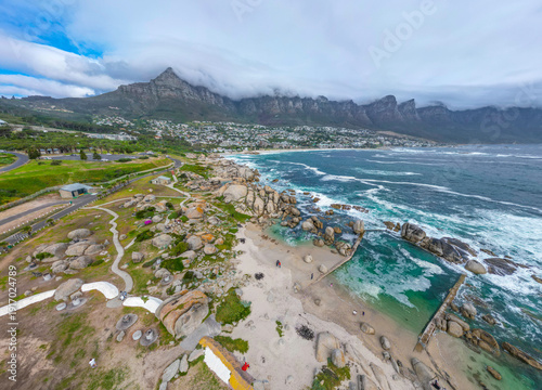 Cape town aerial drone shot showing Atlantic ocean and camps bay area in South Africa
