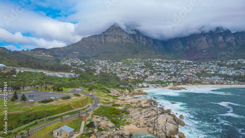 Cape town aerial drone shot showing Atlantic ocean and camps bay area in South Africa