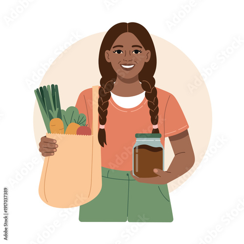A smiling woman holding a bag of fresh vegetables and a jar of homemade jam