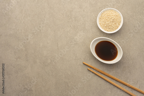 Εκτύπωση καμβά Soy Sauce and Sesame Seeds with Chopsticks on Neutral Background