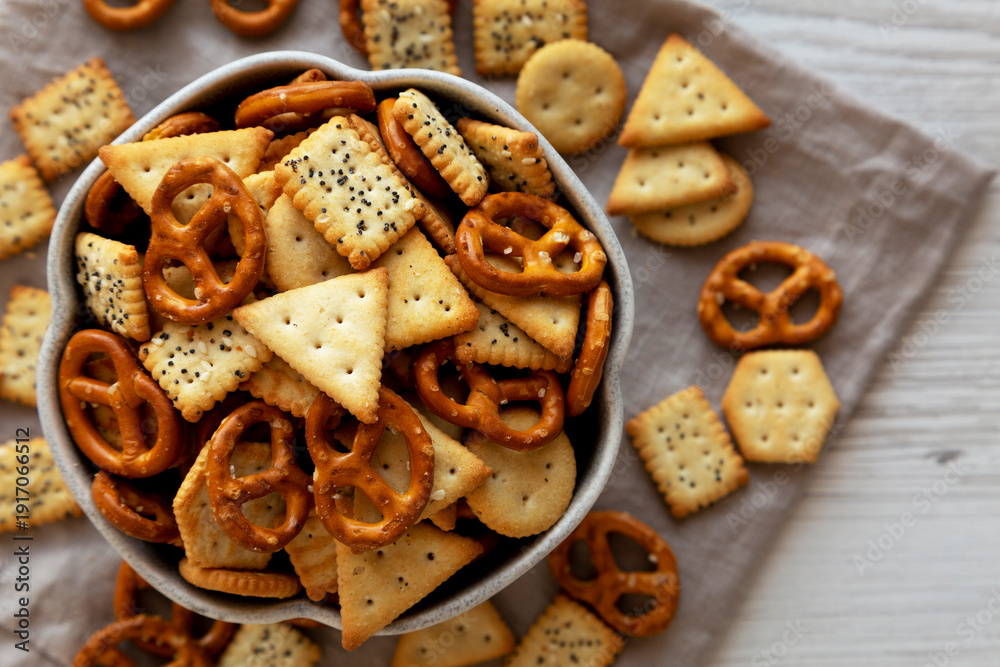 Naklejka premium Crunchy Cracker Snack Mix in a Bowl, top view.