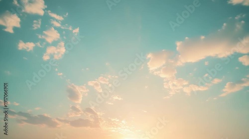 Pastel colors spreading across the peaceful sky creating a vibrant natural backdrop, with soft light from the setting sun illuminating the cumulus clouds