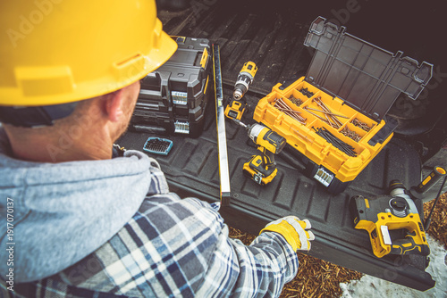 Working on a Project With Tools in a Pickup Truck