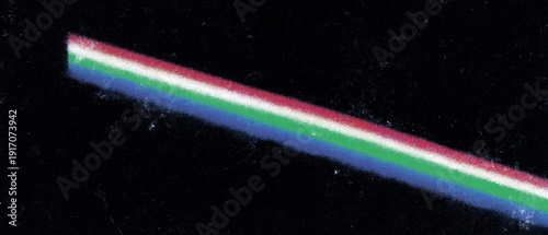 A colorful laser beam streaking across a dark background.