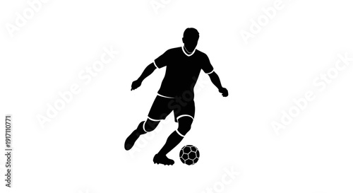 Soccer player kicking ball with feet.