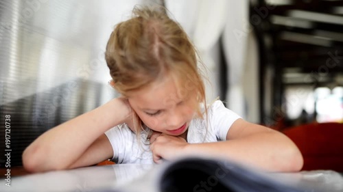 Wallpaper Mural Little blonde girl reading menu Torontodigital.ca