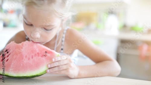 Wallpaper Mural Beautiful blonde small girl eating watermelon Torontodigital.ca