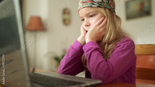 Wallpaper Mural Little blonde girl working on laptop Torontodigital.ca