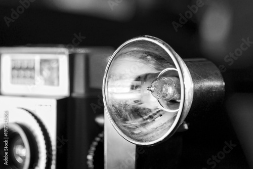 Old Vintage Camera Flash Bulb on Black Background