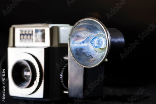 Old Vintage Camera Flash Bulb on Black Background