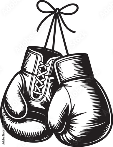 Black and white of boxing gloves hanging by a string with a bow tied laces