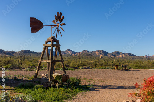 A vintage windmill in Goldfield, later Youngsberg, a gold mining town, now a ghost town in Pinal County, Arizona.