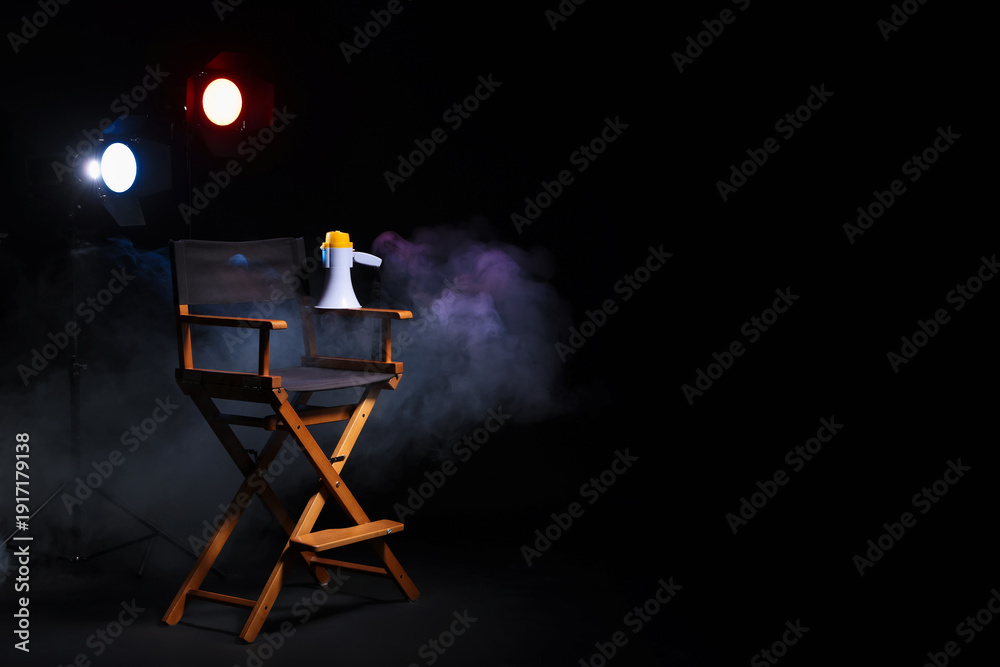 Ταπετσαρία Film director's chair, megaphone and lighting equipment on black background with
