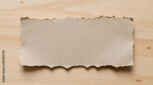 Wallpaper Mural Torn paper on a wooden surface viewed from directly above showing rough texture and edges Torontodigital.ca