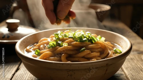 Close up of freshly cooked noodles in a bowl with steam