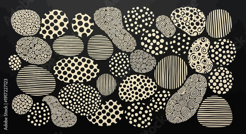 Collection of variously patterned stones on a black background.