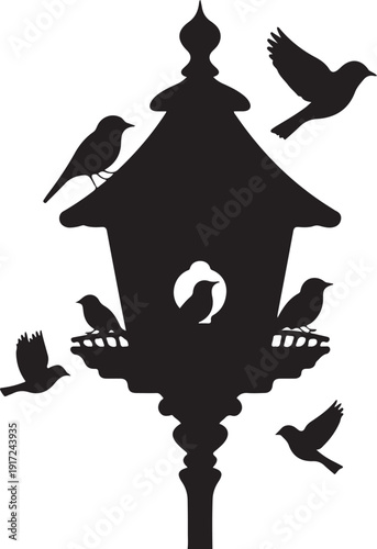 Black silhouette of birdhouse with multiple birds perched and flying