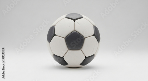 Soccer ball on plain background black and white panels sports equipment