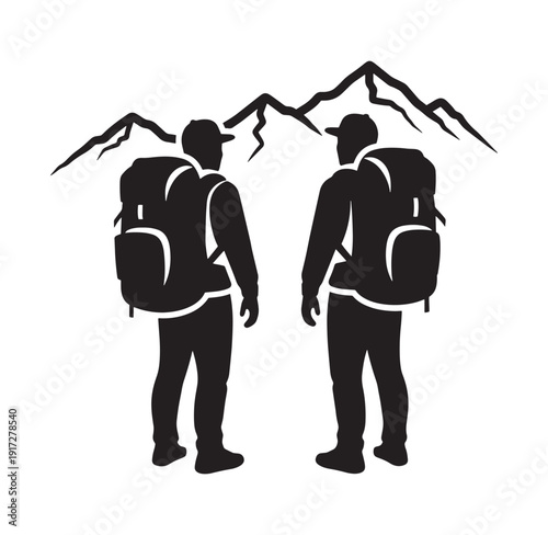 silhouette of two hikers with backpacks standing in front of mountains