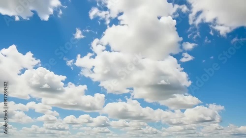 blue sky with white puffy clouds