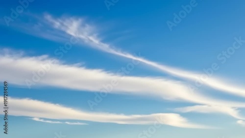 blue sky with wispy white clouds