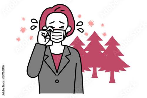 花粉症がつらい中年のスーツの女性