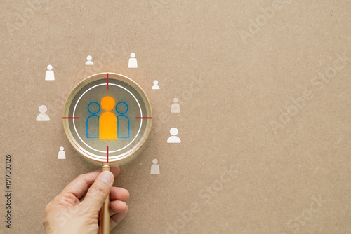 Картината върху платно Hand holding magnifying glass focusing on select target icon