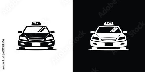 Black and white taxi cars with taxi signs on vehicle