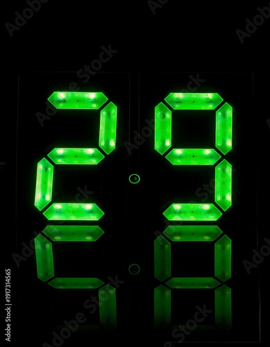 Wallpaper Mural Illuminated digital display showing time, vibrant green digits, with a black background, and subtle reflections Torontodigital.ca