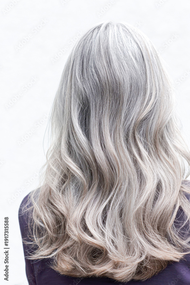Naklejka premium Long wavy silver grey hair from behind