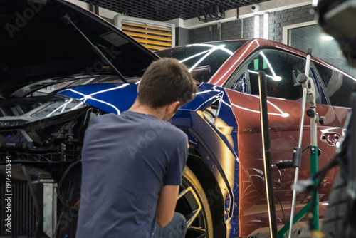 Konstfotografi Process of paintless dent repair on car body