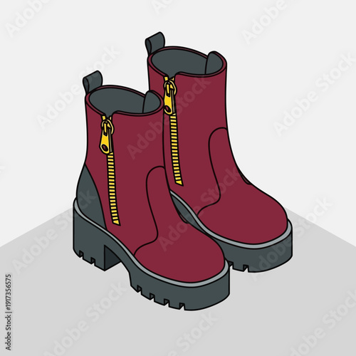 Pair of red boots with yellow zippers on a gray surface.