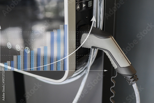 Electric vehicle charging station with graph overlay showing growth trends, symbolizing rise in electric vehicle adoption and sustainable energy solutions