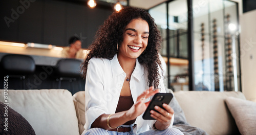 Foto Cellphone, smile and woman on sofa in home with networking, communication or social media online