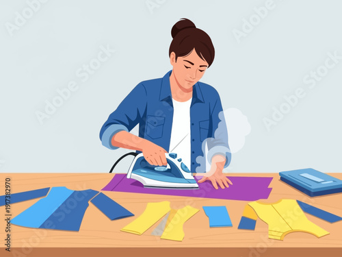 Woman ironing fabric pieces on a wooden table with clothes nearby