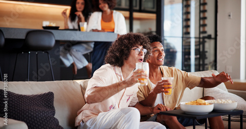 Photography Men, friends and excited with watching tv on sofa with sports game, tournament or match in living room
