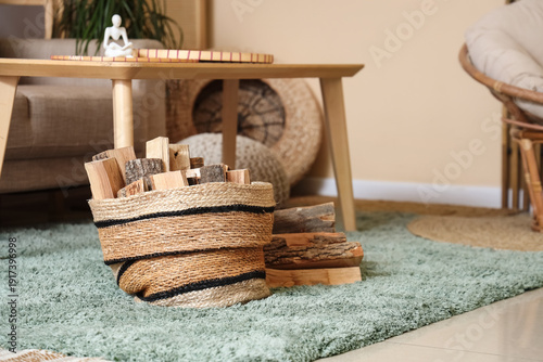 Wicker basket of firewood  ...