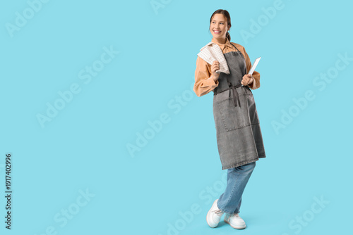 Happy young female barista ...